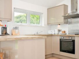 A kitchen with appliances including a kettle and microwave at 1 Horizon View Dobwalls