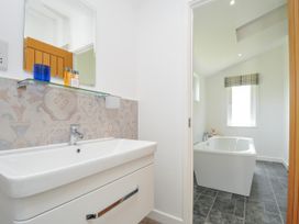 A bathroom with a sink and bathtub at 1 Horizon View in Dobwalls