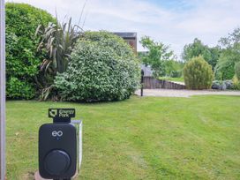 An electric vehicle charger and vegetation in the outdoor area at 1 Horizon View Dobwalls