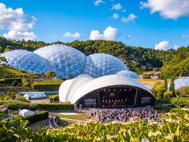 An outdoor stage with geodesic domes in the background at 1 Horizon View Dobwalls