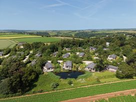 A view of a group of houses near a pond at 1 Horizon View in Dobwalls
