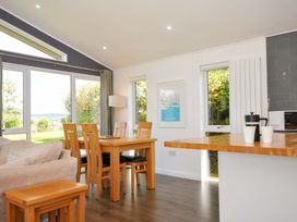 A dining area with a table and chairs at 3 Horizon View in Dobwalls