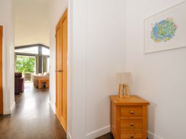 A hallway with a lamp and painting at 3 Horizon View, Dobwalls