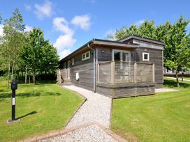 A house with a deck and garden at 12 Meadow Retreat in Dobwalls