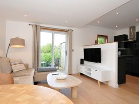 A living room with a sofa and television at 12 Meadow Retreat in Dobwalls