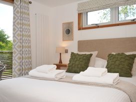 A bedroom with a bed and pillows at 12 Meadow Retreat in Dobwalls