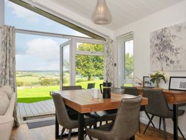 A dining room with a table and chairs at 8 Horizon View in Dobwalls