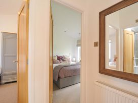 A view of a bedroom with a door and mirror at 8 Horizon View in Dobwalls