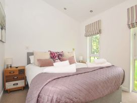 A bedroom with a bed and bedside table at 8 Horizon View in Dobwalls