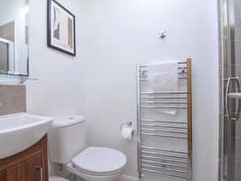 A bathroom with a sink, toilet, towel rail and shower at 8 Horizon View in Dobwalls