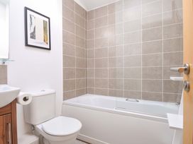 A bathroom with a bathtub and toilet at 8 Horizon View in Dobwalls