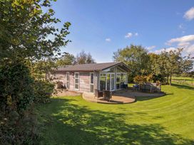 An outdoor view of a cabin with a deck at 8 Horizon View in Dobwalls