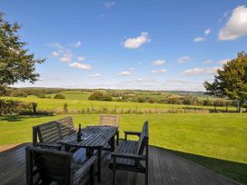An outdoor seating area with a table and chairs at 8 Horizon View in Dobwalls