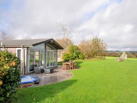 An outdoor area with a hot tub and furniture at 9 Horizon View Dobwalls