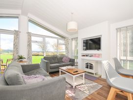 A living room with a sofa and table at 9 Horizon View in Dobwalls