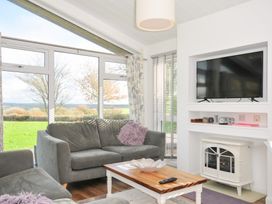 A living room with a sofa and television at 9 Horizon View in Dobwalls