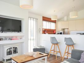 A living room with a TV and sofa at 9 Horizon View in Dobwalls