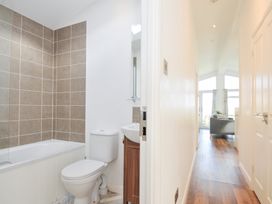 A bathroom with a bathtub, toilet, and sink at 9 Horizon View in Dobwalls