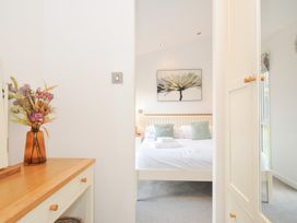 A bedroom featuring a bed and flower artwork at 9 Horizon View in Dobwalls
