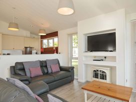 A living room with a sofa and television at 10 Horizon View in Dobwalls