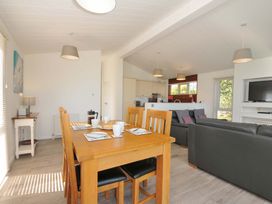 A dining room with a table and chairs at 10 Horizon View in Dobwalls