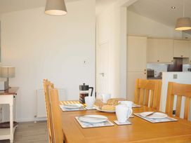 A dining room with a table set for breakfast at 10 Horizon View in Dobwalls