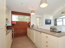 A kitchen with cabinets and a toaster at 10 Horizon View in Dobwalls