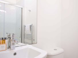A bathroom with a sink, toilet, and shower at 10 Horizon View in Dobwalls