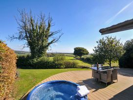 A hot tub and seating area overlooking a landscape at 10 Horizon View in Dobwalls