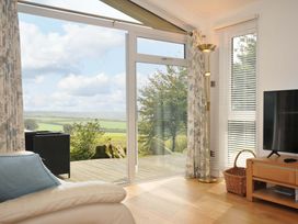 A living room with a view of the outdoors at 11 Horizon View in Dobwalls