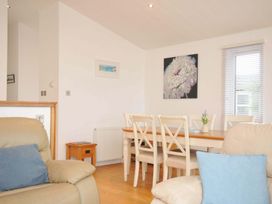 A dining room with a table and chairs at 11 Horizon View Dobwalls