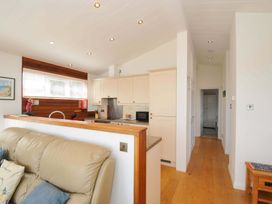 A kitchen with a sofa and appliances at 11 Horizon View Dobwalls