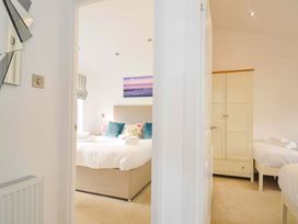 A bedroom with a bed and cabinet at 11 Horizon View in Dobwalls