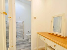 A bathroom with a toilet and a vanity table at 11 Horizon View in Dobwalls