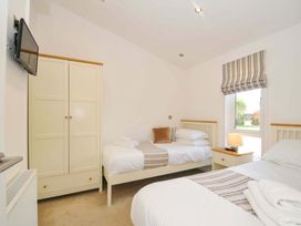 A bedroom with two beds and a wardrobe at 11 Horizon View in Dobwalls