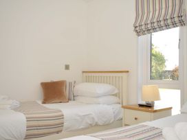 A bedroom with beds and a lamp at 11 Horizon View Dobwalls