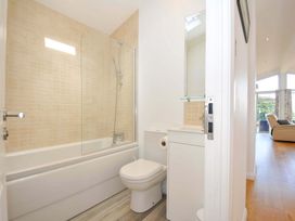 A bathroom with a bath, toilet, and sink at 11 Horizon View in Dobwalls