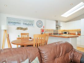 A kitchen with a dining table and chairs at 15 Horizon View Dobwalls
