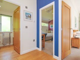 A hallway with doors to bathroom and bedroom at 15 Horizon View in Dobwalls