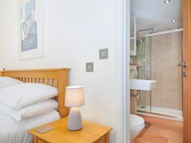 A bedroom with a bed and en-suite bathroom at 15 Horizon View Dobwalls