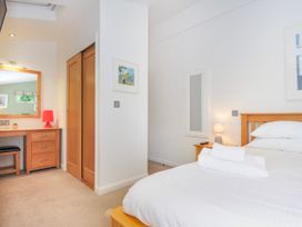 A bedroom with a bed and dresser at 15 Horizon View in Dobwalls