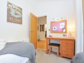 A bedroom with a bed and desk at 15 Horizon View Dobwalls