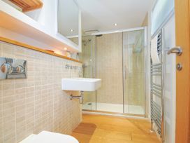 A bathroom with a sink, shower, and towel rail at 15 Horizon View in Dobwalls