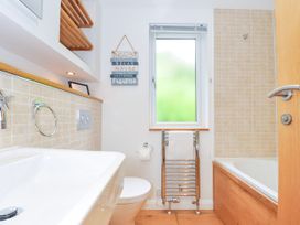 A bathroom with a sink, toilet, and bathtub at 15 Horizon View in Dobwalls