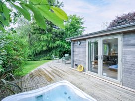 An outdoor area with a hot tub and deck at 15 Horizon View in Dobwalls