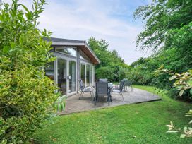 A garden with seating area and greenery at 15 Horizon View in Dobwalls