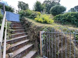 A garden with stairs and a gate at Delfryn, Newport