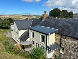 A house with a garden and outdoor seating at Delfryn, Newport