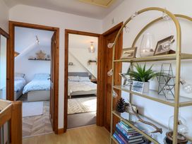 A hallway with doors leading to bedrooms at Hillsview in Combe Martin