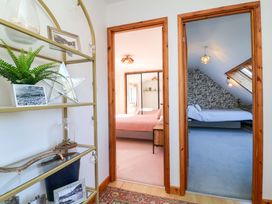 A hallway leading to two bedrooms at Hillsview in Combe Martin